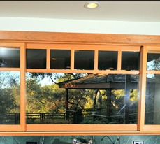 Tight space in this Topanga, California kitchen was maximized by cherry storage boxes built into the walls, as on a ship. Topanga, California kitchen photos by Peter R. Taft Photography.