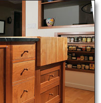 The island was designed to maximize work space and storage, while accommodating an antique butcher block, which Northbeach completely refurbished.