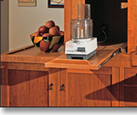The tansu provides ample storage and work space, all in a beautiful alternative to an ordinary wall of upper and lower cabinets with an appliance-cluttered countertop.