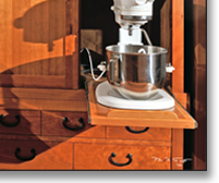The tansu provides ample storage and work space, all in a beautiful alternative to an ordinary wall of upper and lower cabinets with an appliance-cluttered countertop.
