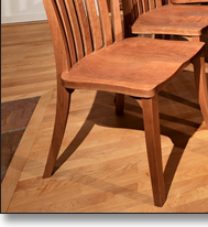 Cherry millwork integrates the dining furniture and surrounding architecture. Dining room photos by Peter R. Taft Photography.