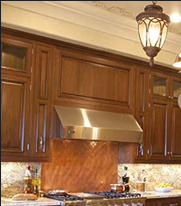 Traditional styling includes turned columns and solid raised panel doors.