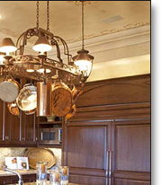Traditional styling includes turned columns and solid raised panel doors.