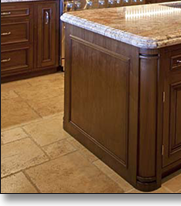 Traditional styling includes turned columns and solid raised panel doors.