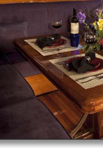 Teak dining table J.T. John created to match existing design elements elsewhere on the yacht,  including radiused corners and lamb's tongue details. Photo by Neil Rabinowitz; yacht restoration by Tom George.