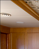 Curved media storage and matching settee and table pedestal in oak, which J.T. John designed for the same Washington based yacht.