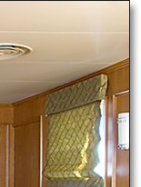 Curved media storage and matching settee and table pedestal in oak, which J.T. John designed for the same Washington based yacht.