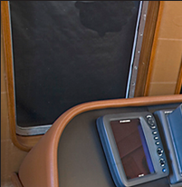 Teak console and window framing replaced original pilot house maple, which had yellowed with age.