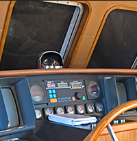 Teak console and window framing replaced original pilot house maple, which had yellowed with age.