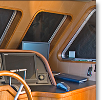 Teak console and window framing replaced original pilot house maple, which had yellowed with age.