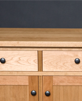 Cherry sideboard designed by J.T. John; note grain match on the drawer fronts, built from a single piece of wood.
