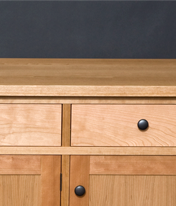 Cherry sideboard designed by J.T. John; note grain match on the drawer fronts, built from a single piece of wood.