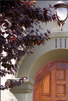 Arched mahogany front door, designed by J.T. John for a Los Angeles, California home, after considerable research into the original design features of the 1920's house and neighborhood.