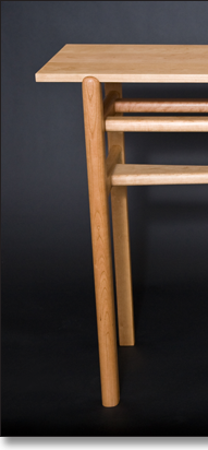 Matching cherry sofa table designed by J.T. John.