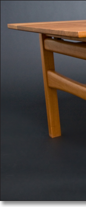 Cherry coffee table designed by J.T. John.
