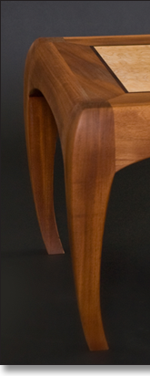 Coffee table designed by J.T. John in western maple and mahogany.