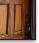 Arched mahogany front door, designed by J.T. John for a Los Angeles, California home, after considerable research into the original design features of the 1920's house and neighborhood.